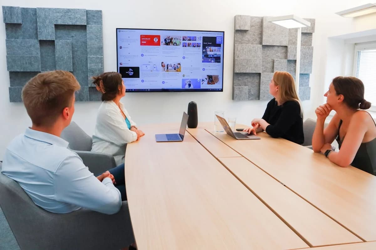 Marketing team reviewing a brand film and choosing its music