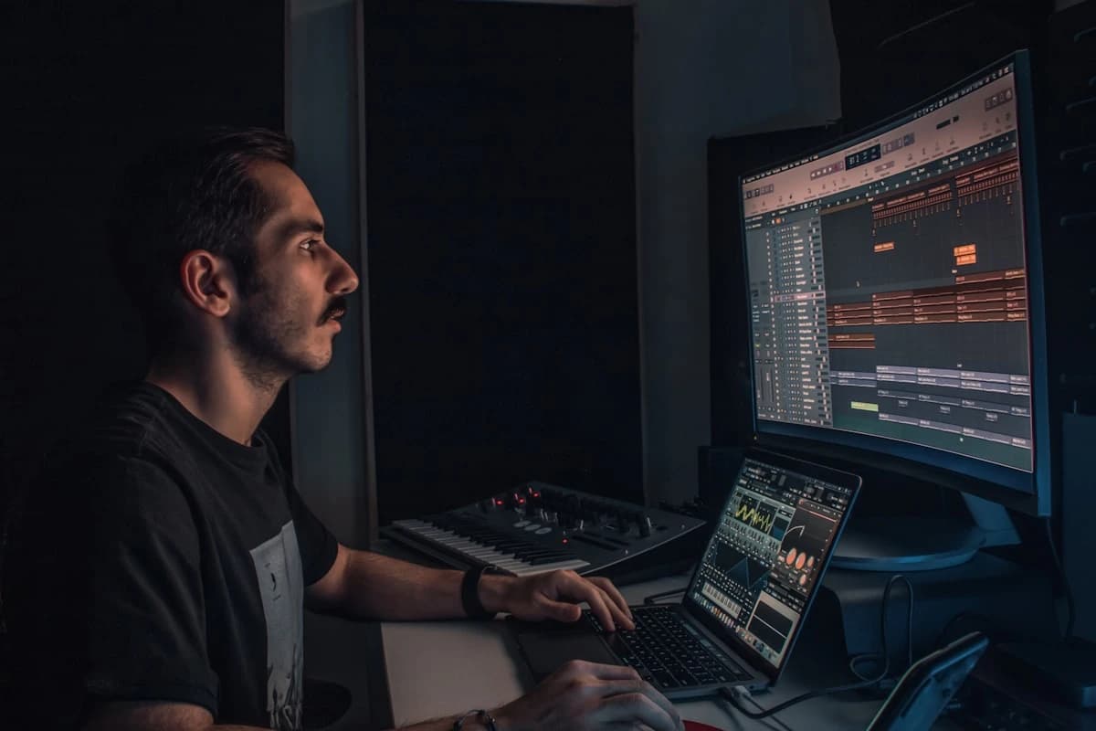 Musician labelling saved voice references on a laptop