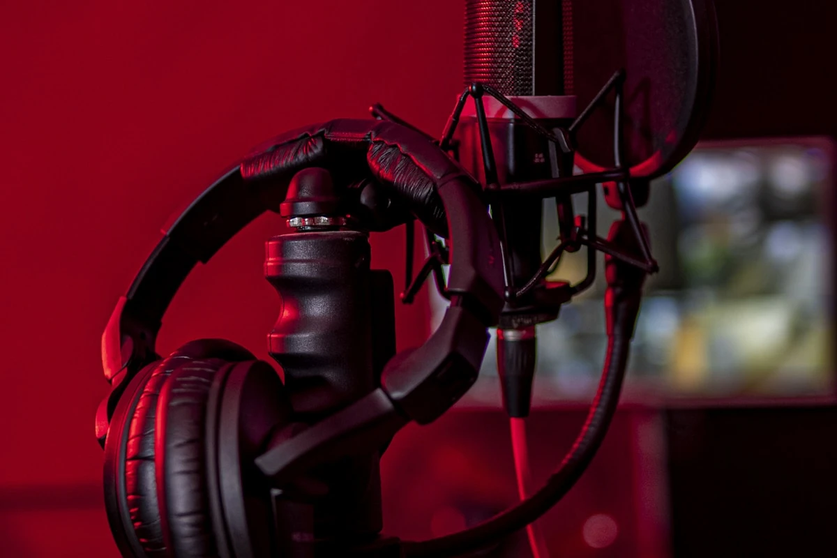 Vocalist capturing a source take on a studio microphone